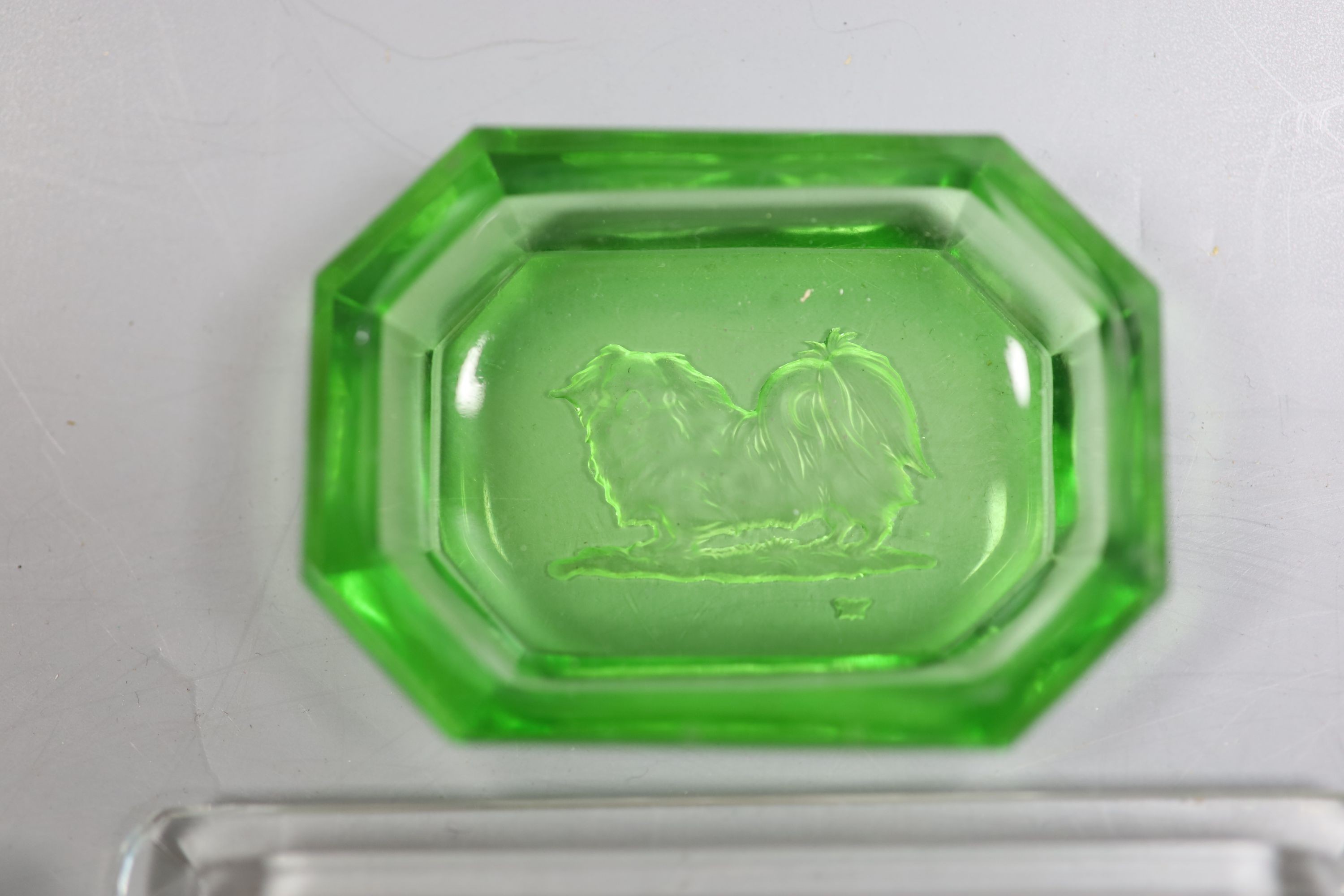 Ten items of Heinrich Hoffmann intaglio moulded glass, largest 11cm